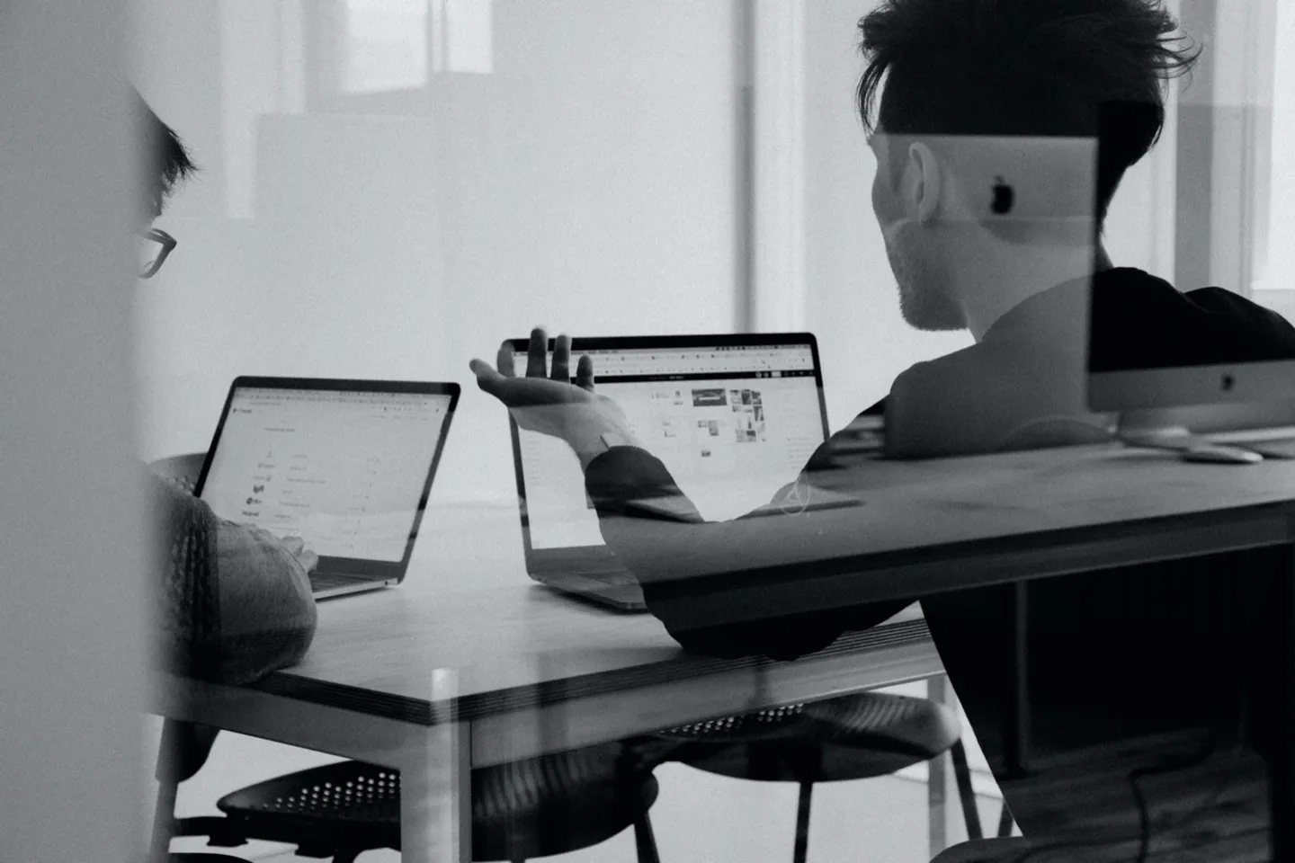 Working at a desk in the IDNotion office